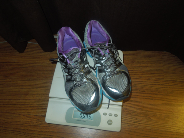 a pair of woman's running shoes weigh 